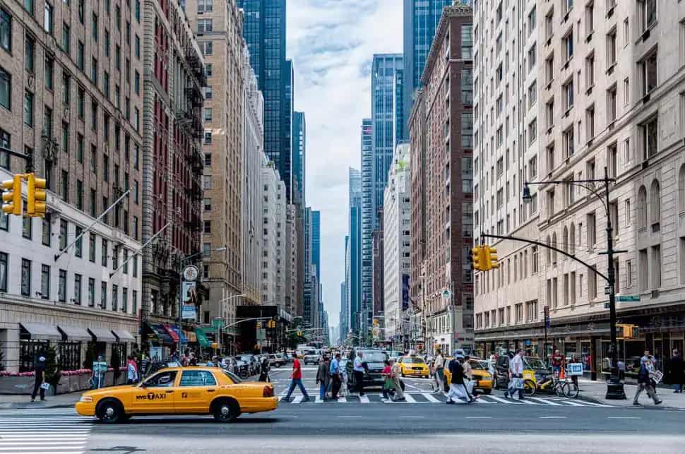 Yellow taxis and pedestrians on a busy New York City street