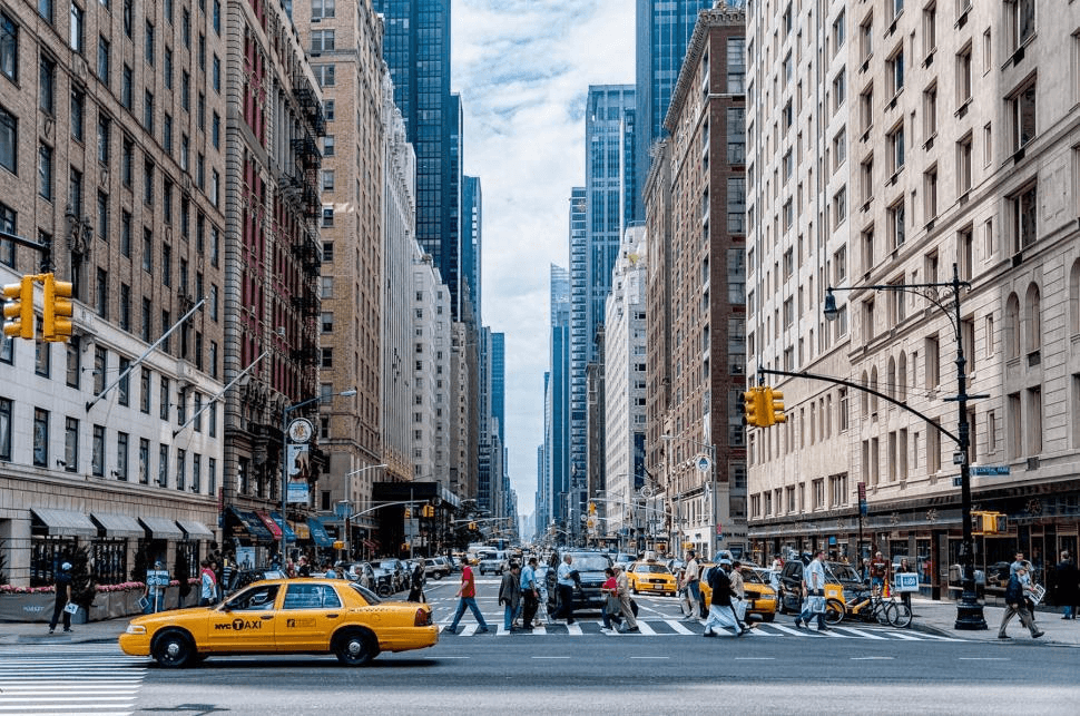 Yellow taxis and pedestrians on a busy New York City street
