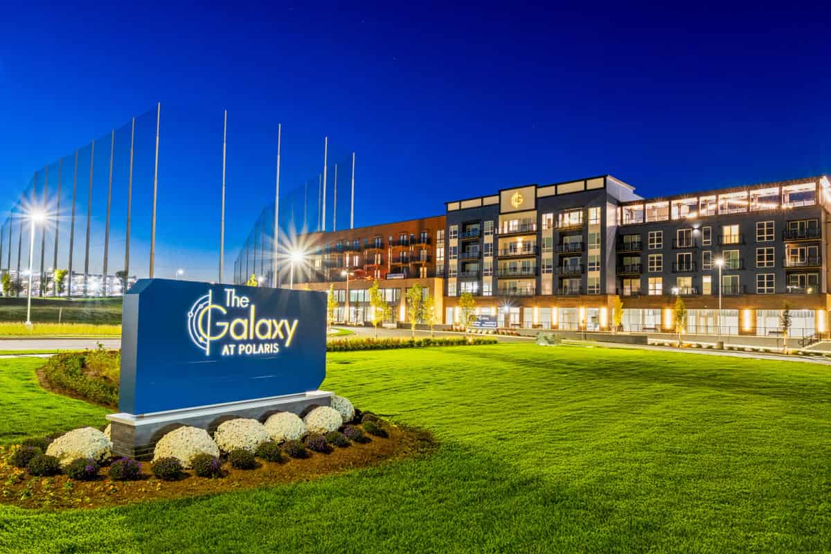 The Galaxy at Polaris apartment community in Columbus illuminated at dusk