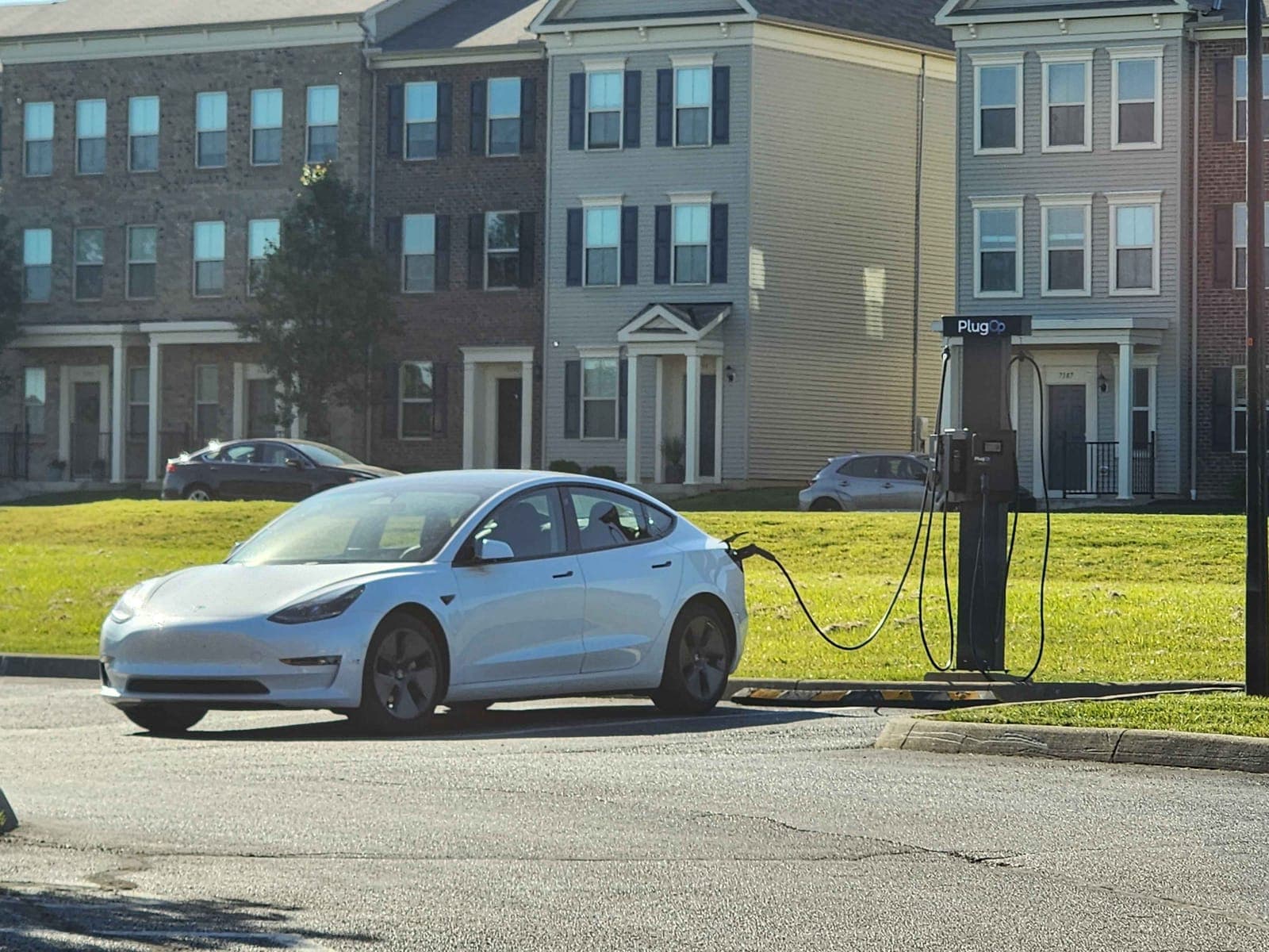 A PlugOp EV charger serving a multifamily townhome community
